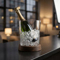 Create a sophisticated product shot of the Harvey Ice Bucket set, positioned on a sleek modern bar counter illuminated with softbox lighting that highlights the transparency and texture of the glassware. Capture from a slightly elevated angle with a 50mm l
