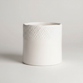 Create a high-resolution, studio-style image of the 'Scowle Planter Pot White' set against a neutral, softly blurred background that emphasizes the product. Use softbox lighting with diffused daylight to highlight the smooth, matte white ceramic surface an