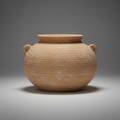 Create a stunning, high-resolution studio shot of the Augustine Pot Light terracotta against a sleek, neutral gray backdrop. Utilize softbox lighting to produce even, diffuse illumination that highlights the warm, earthy tones and intricate hand-decorated 