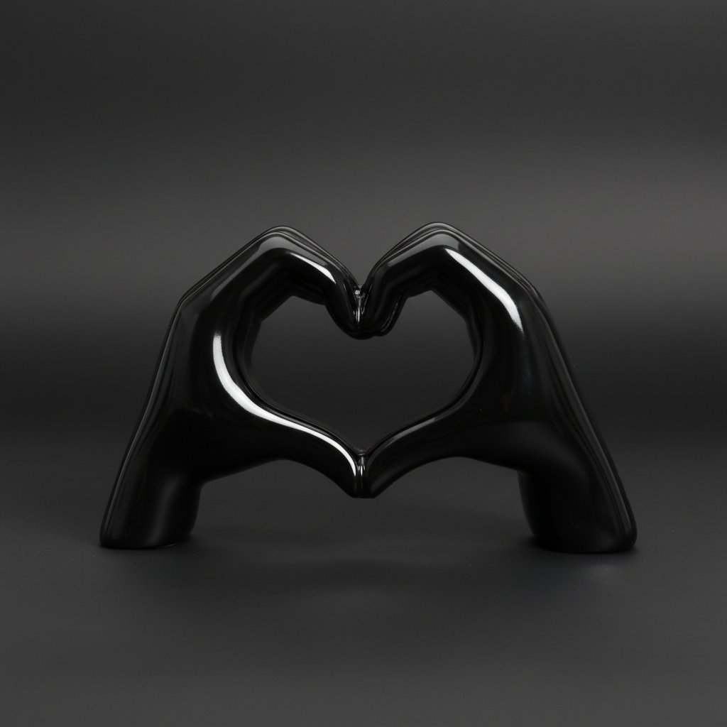 A highly detailed, studio-shot image of the 'Heart in hand black' sculpture, illuminated by a softbox lighting setup that emphasizes the glossy, polished resin surface. The camera is positioned at a 45-degree angle with a macro lens at 100mm focal length, 