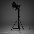 Create a hyper-realistic studio product shot of the 'Chandri Metal Lamp - Black' positioned prominently in a high-end photography studio setting. Use softbox lighting to evenly illuminate the sleek matte black finish and textured metal surface, highlightin