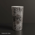 Capture a highly detailed, high-resolution studio shot of the 'Snake Skin Vase' from a slightly elevated front perspective, using a 100mm macro lens with a shallow depth of field to emphasize the textured snake skin pattern. Employ softbox lighting to even