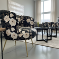 A luxurious Cloe Flower Print Chair showcased in a sophisticated, modern living room setting. The scene is illuminated with diffused daylight using HDR studio lighting, highlighting the plush velvet texture and intricate floral print of the fabric. The cam