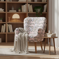 Create a cinematic, lifestyle scene featuring the Noja velvet Arm Chair Pupuga in a stylish, contemporary reading nook. Utilize HDR studio lighting to capture the textures and details of the plush velvet fabric, with a focus on warmth and inviting mood. Th