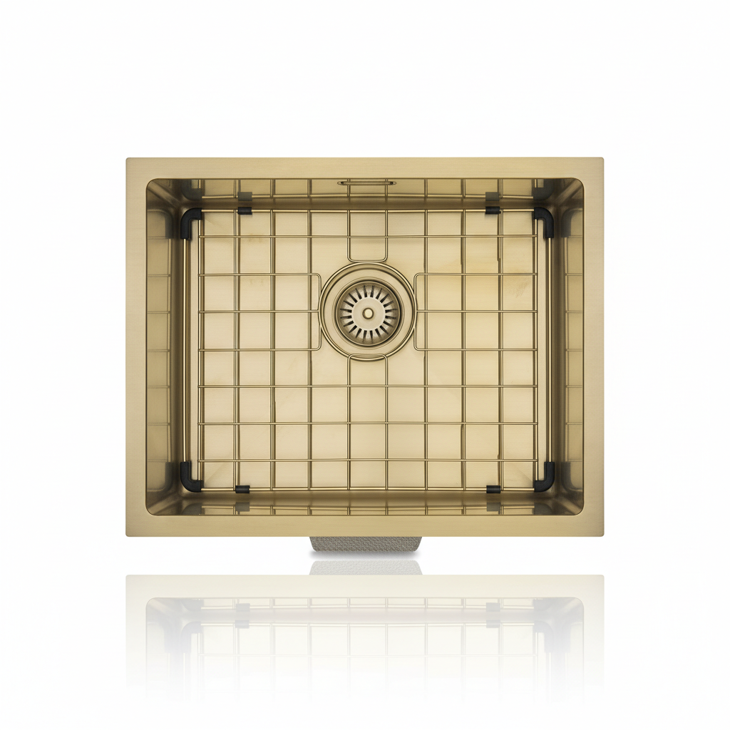 A sophisticated, lifestyle studio setup presenting the Aurora Stainless 400mm x 500mm brass sink in an upscale modern kitchen scene. The sink is styled within a sleek, contemporary stainless steel countertop, capturing a top-angle shot with a 35mm lens tha