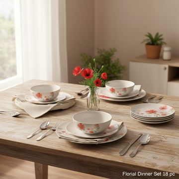 A stylish lifestyle composition featuring the Florial Dinner Set 18 pc arranged on a rustic wooden table in a bright, naturally lit dining room. Natural diffuse daylight filters through a large window, creating a warm, inviting ambiance. The camera is set 