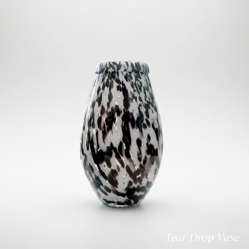 Capture a high-resolution, studio-shot image of the Tear Drop Vase from a slightly elevated angle using a 50mm prime lens to emphasize its elegant tear-drop shape. Set against a minimalist, matte white backdrop illuminated by softbox lighting for diffused,